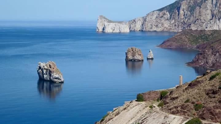 L'Estasi Tanca Piras A Bordo Piscina Con Vista Mare Villa Nebida ภายนอก รูปภาพ